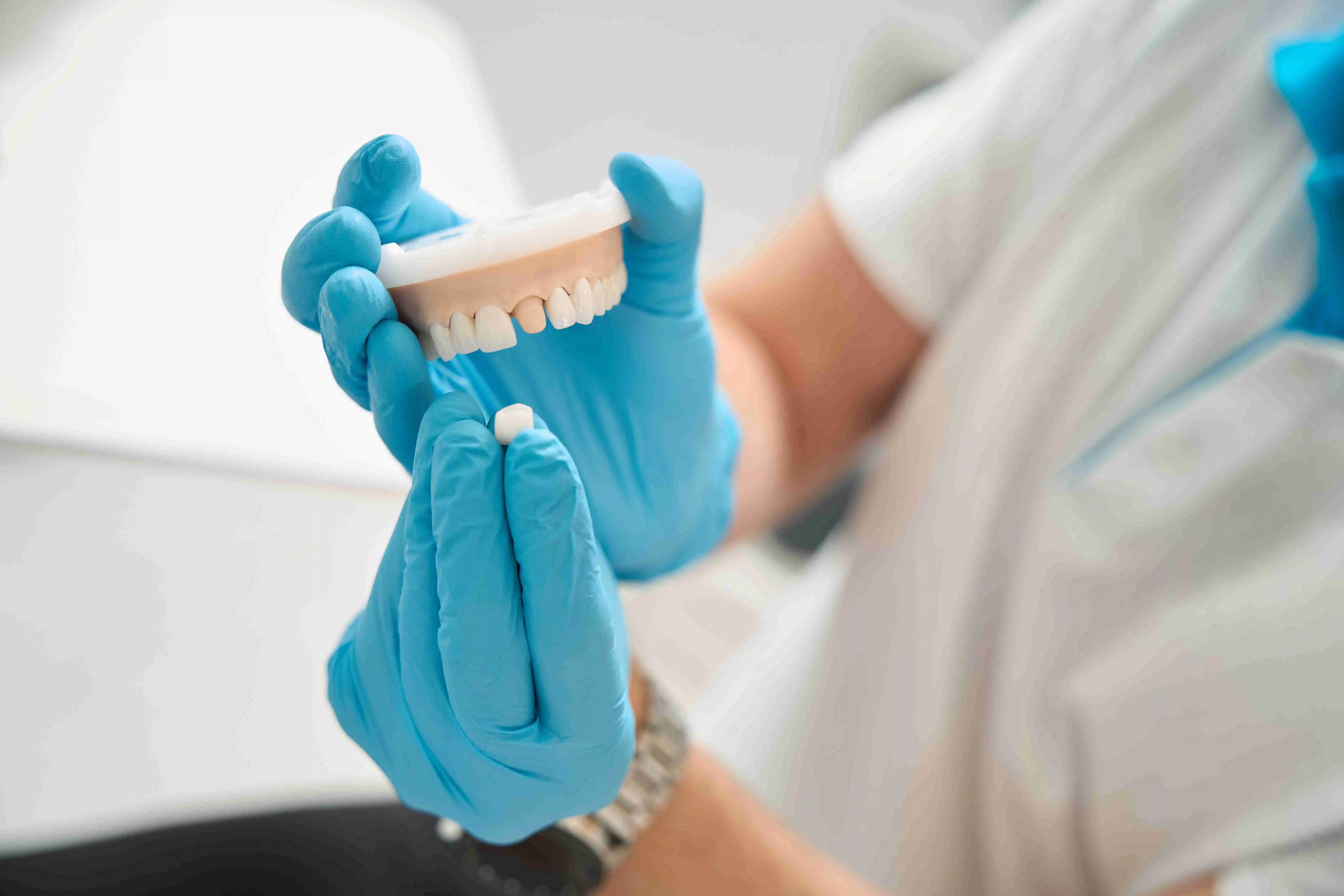 orthodontist preparing to carry out dental crown